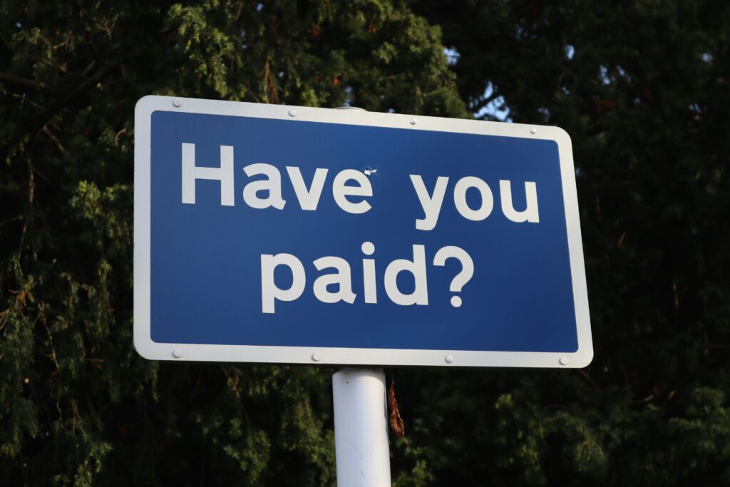 Crypto transfer payment reminder represented by a sign asking, “Have you paid?”