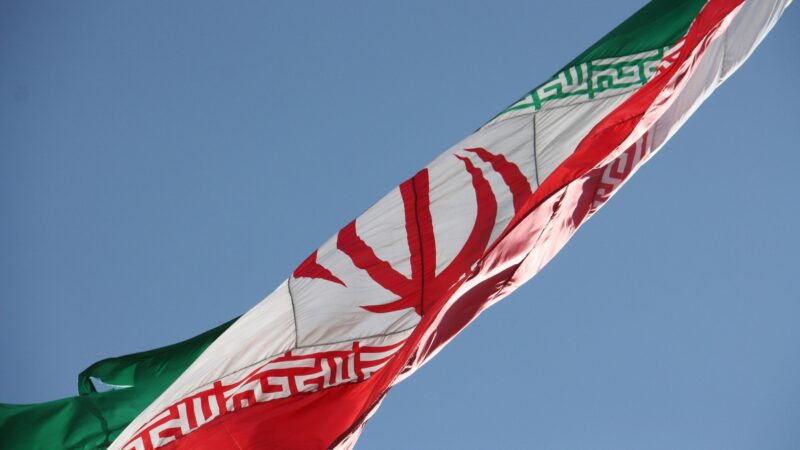 Iranian flag depicting US IRAN strikes