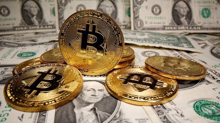 Bitcoin coins on US dollar bills representing crypto bills, Bitcoin reserve and crypto regulation