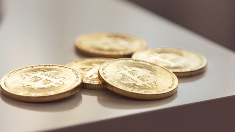 Bitcoin coins representing Bitcoin ETF Bitcoin golden cross Bitcoin price Bitcoin demand and US spot ETFs
