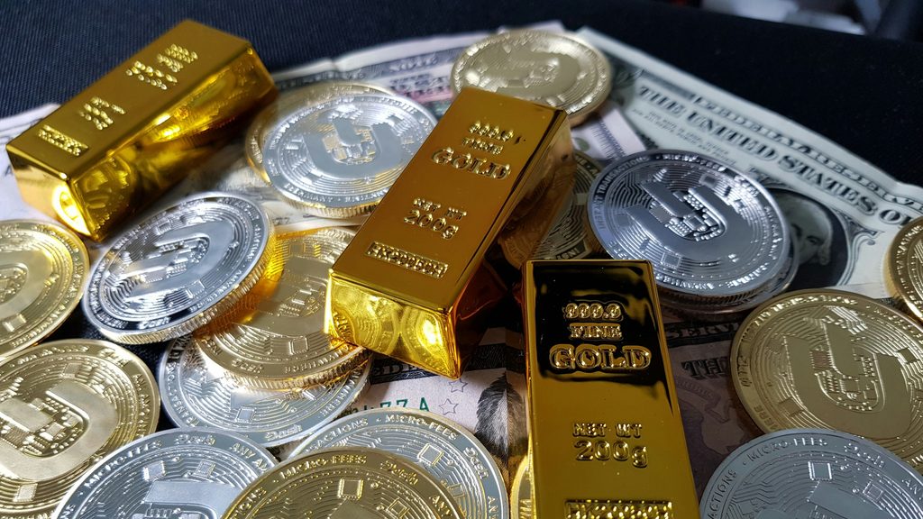 Gold and silver bars and coins showing gold price, silver price, precious metals, and gold forecast trends.