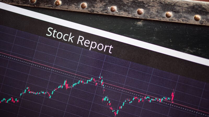 stock report with arrow going upwards