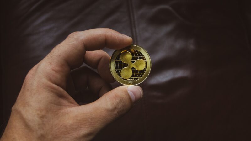 Ripple XRP coin representing Ripple Wall Street expansion, XRP Ledger tokenized commodities and Ripple financial institutions and XRPL