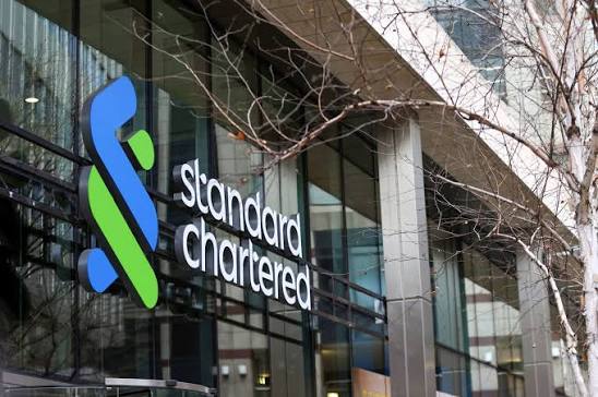 Standard Chartered logo on the facade of one of the bank's office buildings